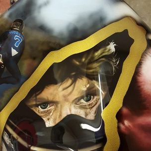 Airbrushed Painting of a Guy Martins eyes in a helmet on a petrol tank